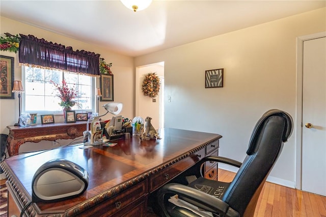 office area with wood finished floors and baseboards
