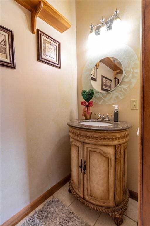 bathroom with tile patterned floors, vanity, and baseboards
