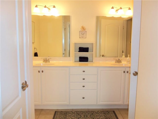 full bathroom featuring tile patterned flooring, double vanity, and a sink