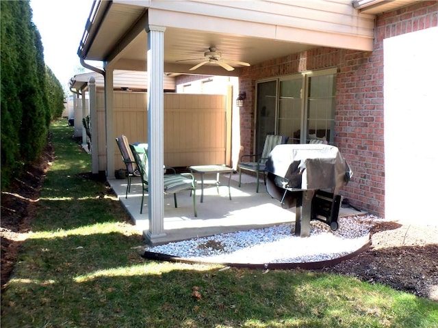 view of patio / terrace with area for grilling and a ceiling fan