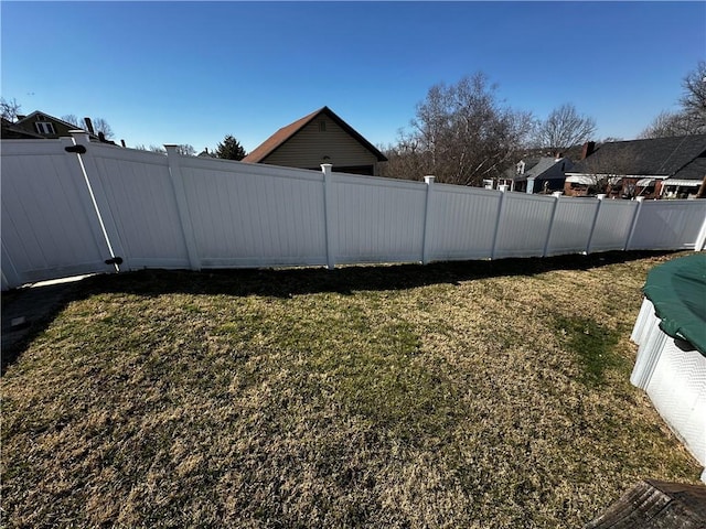 view of yard featuring a fenced backyard