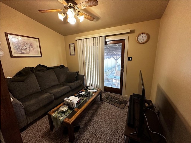 living area with carpet, a ceiling fan, and vaulted ceiling