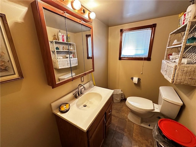 39 Dunkard Ave, Uniontown, PA 15401 - half bath with toilet, vanity, and stone finish floors