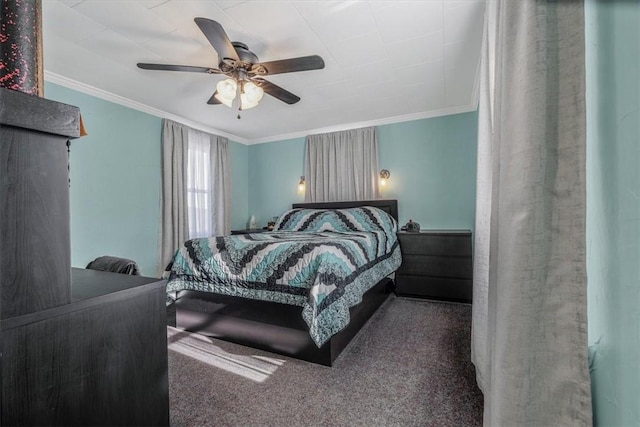 bedroom featuring crown molding, carpet floors, and ceiling fan