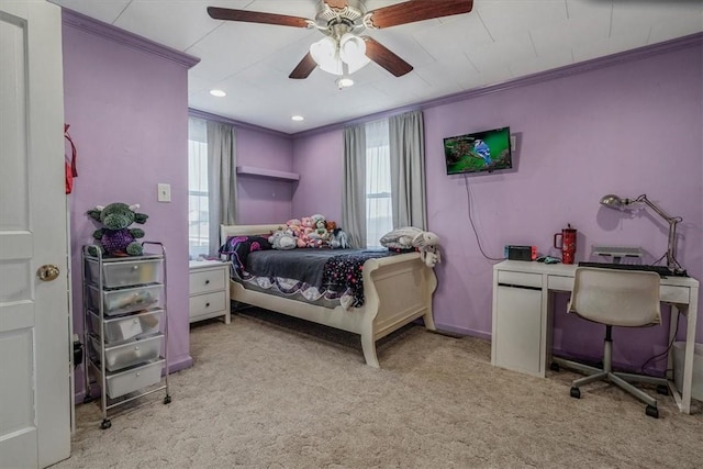 bedroom featuring light carpet, a ceiling fan, baseboards, and ornamental molding