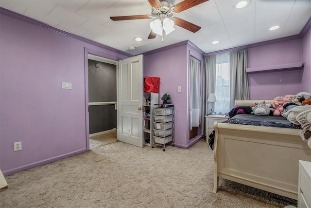 bedroom with crown molding, carpet, and baseboards