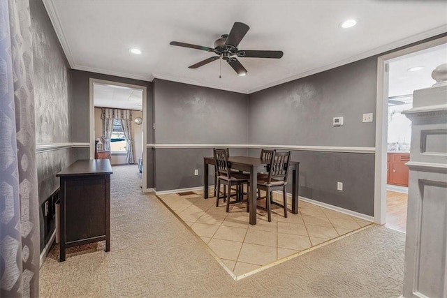 carpeted dining area with recessed lighting, a ceiling fan, baseboards, and ornamental molding