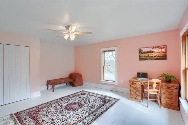 office featuring a ceiling fan and wood finished floors