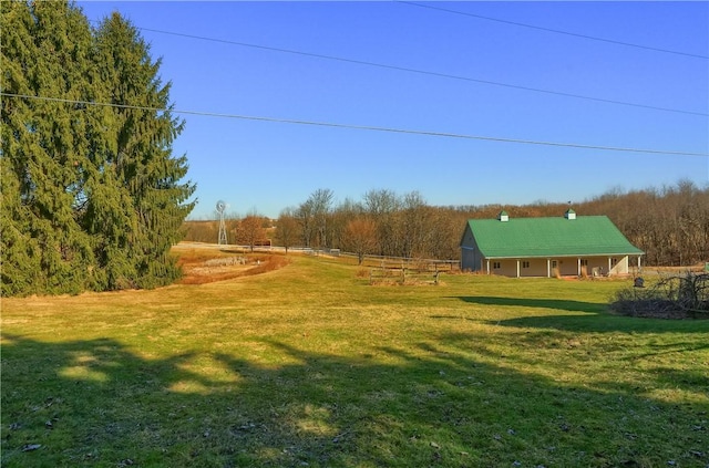 view of yard featuring a rural view and fence