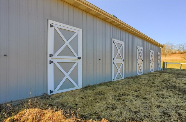 view of outbuilding with an outbuilding and fence