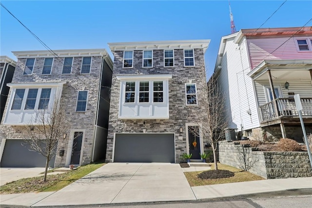 view of front of house with concrete driveway and an attached garage