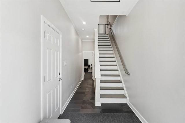 stairway with recessed lighting and baseboards