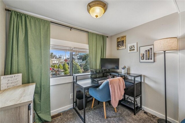 office space featuring visible vents, baseboards, and dark carpet