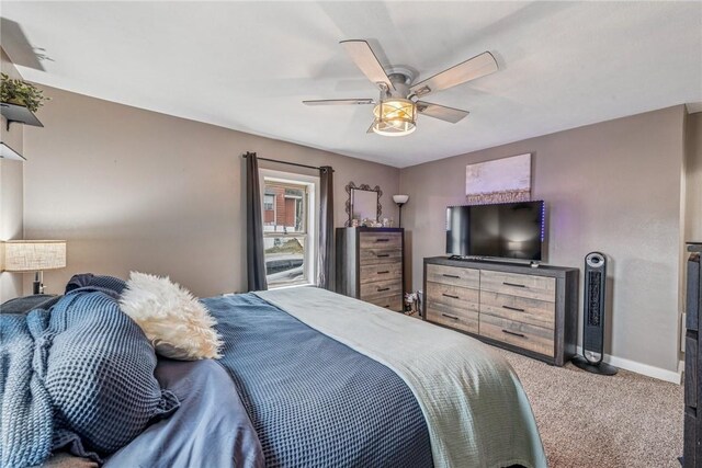 bedroom featuring a ceiling fan, baseboards, and carpet floors