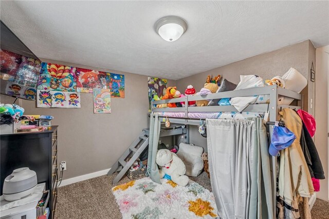 carpeted bedroom with baseboards