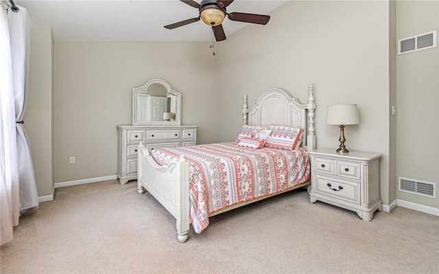 bedroom featuring visible vents, light colored carpet, and baseboards