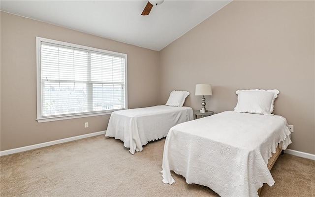 carpeted bedroom with baseboards, lofted ceiling, and ceiling fan