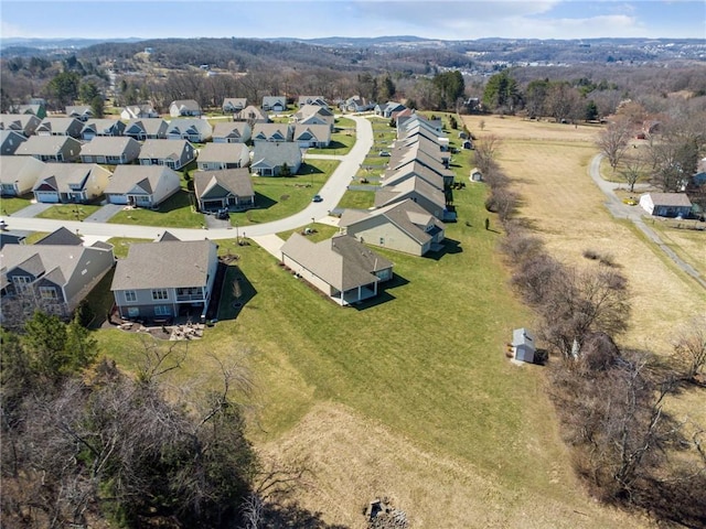 birds eye view of property with a residential view