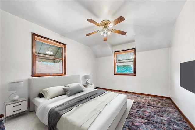 bedroom featuring lofted ceiling, carpet flooring, a ceiling fan, and baseboards