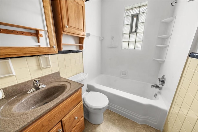 full bath with vanity, shower / bath combination, tile walls, toilet, and backsplash