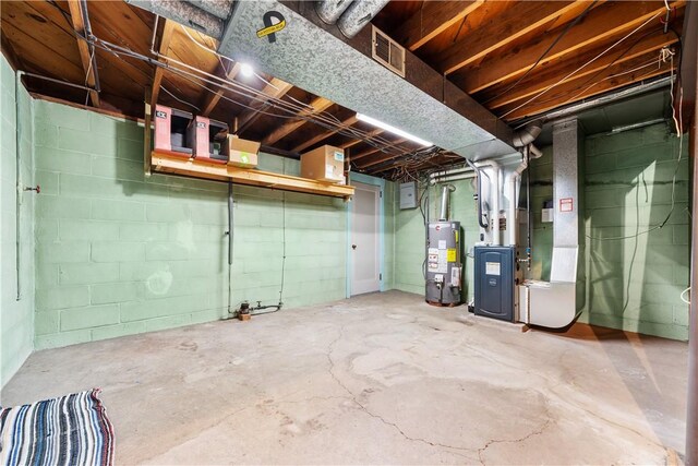 unfinished below grade area with heating unit, visible vents, and gas water heater