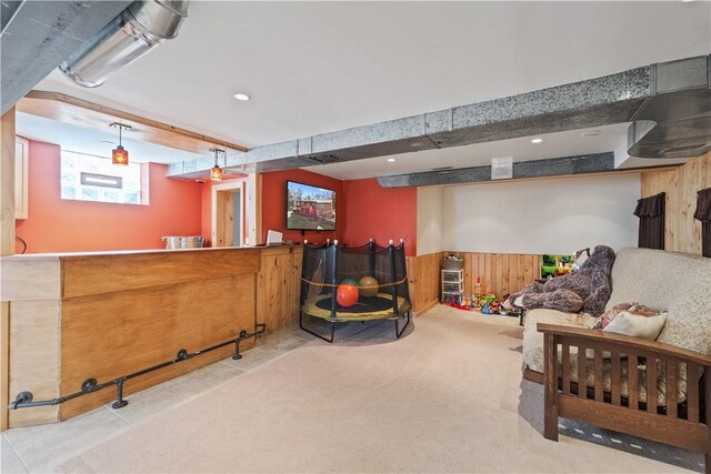 interior space with wooden walls, recessed lighting, carpet floors, and wainscoting