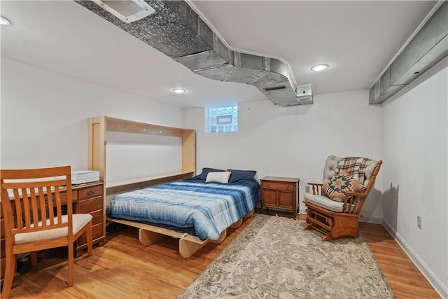 bedroom featuring recessed lighting, baseboards, and wood finished floors