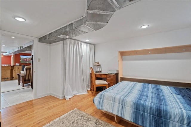 bedroom featuring recessed lighting and light wood-style floors