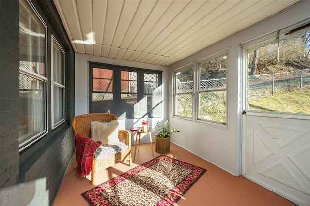 sunroom / solarium featuring wood ceiling