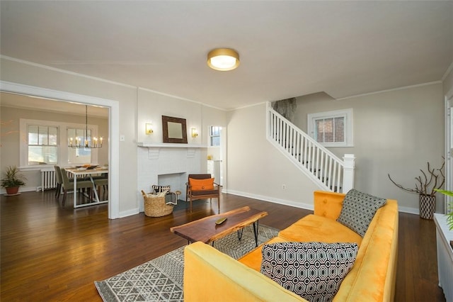 living room with stairs, wood finished floors, and baseboards