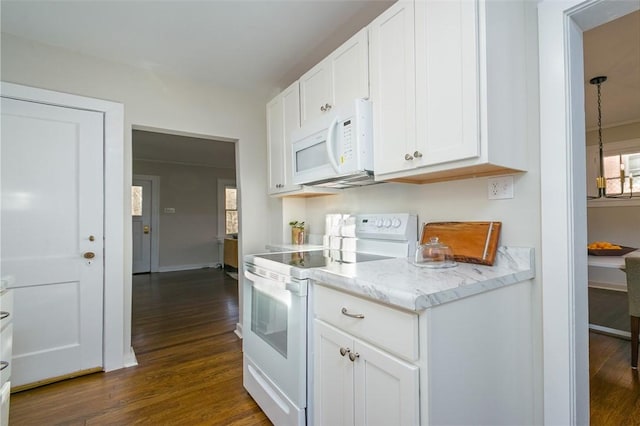 kitchen featuring dark wood finished floors, white appliances, white cabinetry, and light stone countertops