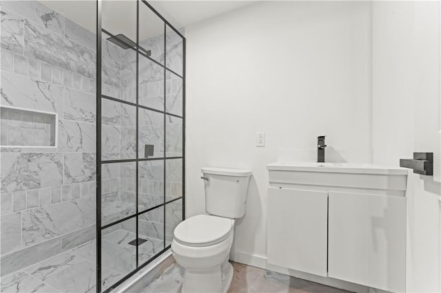 bathroom with baseboards, tiled shower, toilet, and vanity