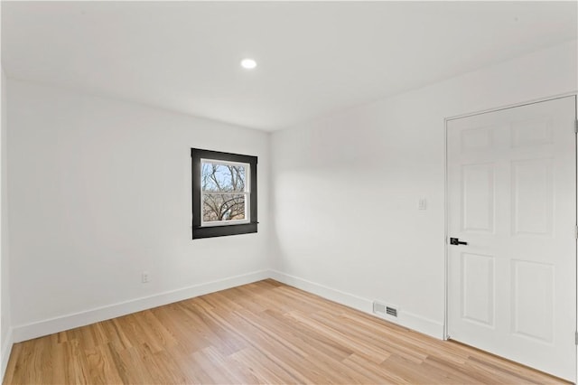 unfurnished room with recessed lighting, visible vents, baseboards, and light wood-style flooring