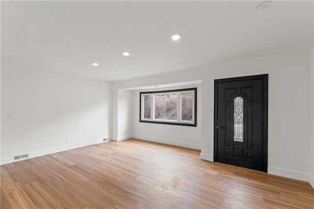 foyer entrance featuring recessed lighting, visible vents, baseboards, and light wood finished floors