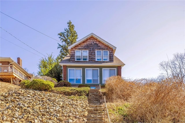 view of front of property featuring brick siding