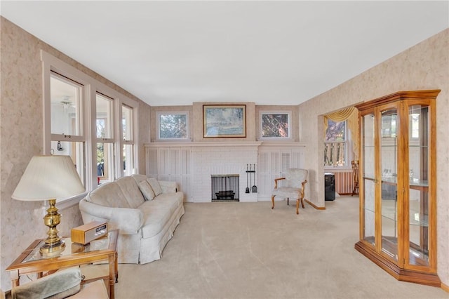 living room featuring a fireplace and carpet flooring