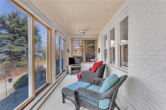 sunroom / solarium with baseboard heating and a healthy amount of sunlight