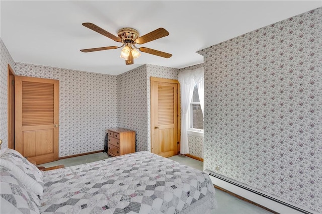 carpeted bedroom featuring baseboards, baseboard heating, a ceiling fan, and wallpapered walls