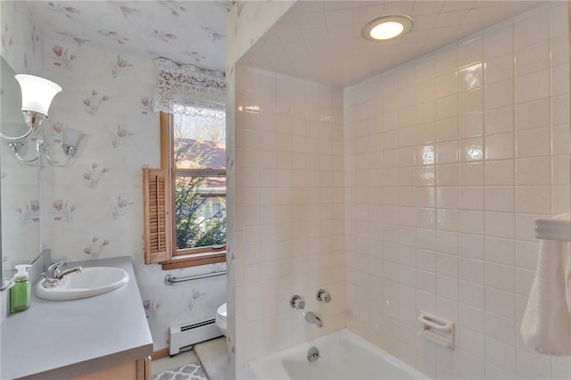 full bathroom featuring baseboard heating, toilet, wallpapered walls, bathing tub / shower combination, and vanity