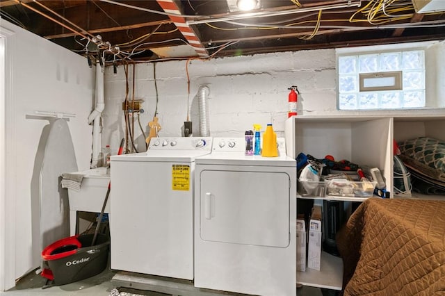 washroom with laundry area and independent washer and dryer