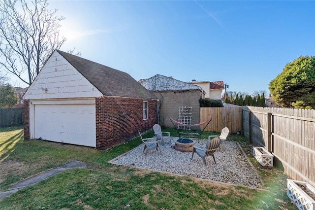 view of yard featuring fence private yard and an outdoor fire pit