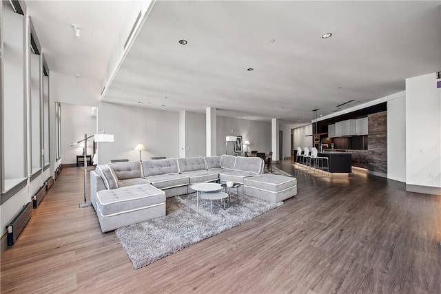 living area featuring recessed lighting and wood finished floors