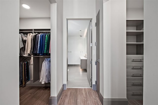 spacious closet with wood finished floors