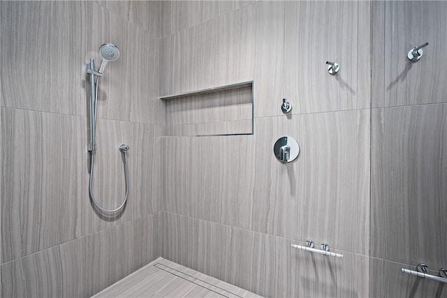 full bathroom with tiled shower