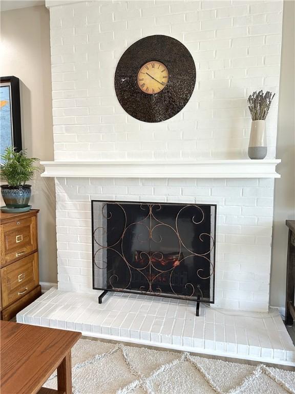 details featuring a brick fireplace