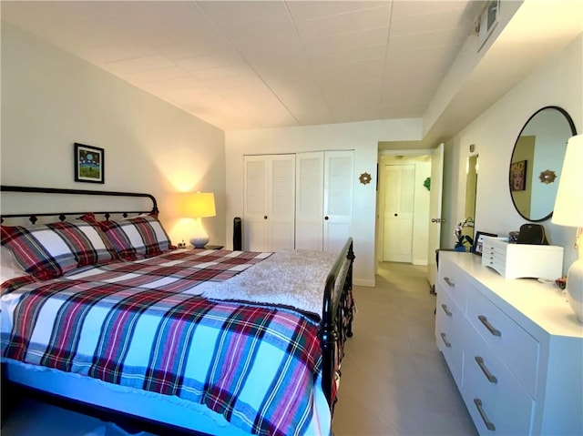 bedroom featuring a closet and visible vents