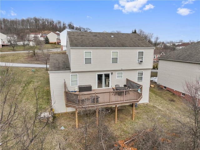 back of house with cooling unit, a wooden deck, and a shingled roof