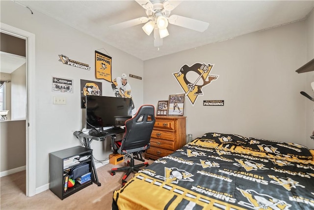 carpeted bedroom with baseboards and ceiling fan