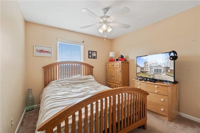 bedroom with baseboards, light colored carpet, and ceiling fan