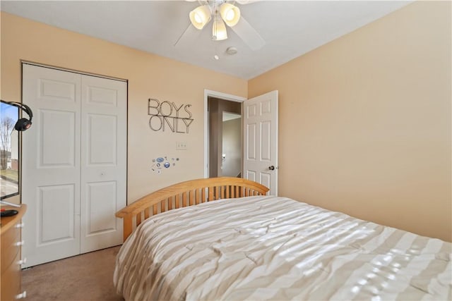 carpeted bedroom with a closet and a ceiling fan